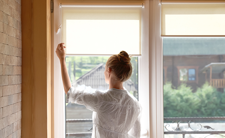 Free-hanging roller blind in minimalistic interrior